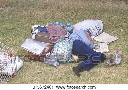 Homeless woman sleeping in a park View Large Photo Image Stock Image - Homeless woman sleeping in a park. Fotosearch