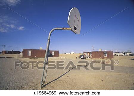 Stock Photo - Housing project with basketball court. Fotosearch