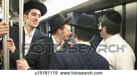 Jewish males with yarmulke ride train View Large Photo Image Stock Photo - Jewish males with yarmulke ride train. Fotosearch