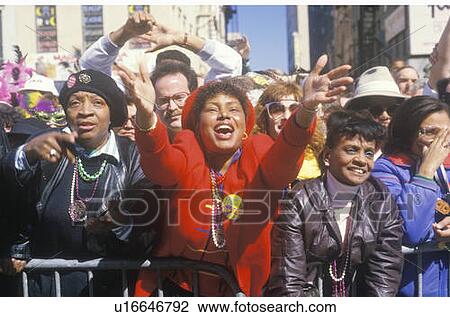 Joyous Spectators at Mardi Gras Parade and African American woman, New Orleans, Louisiana View Large Photo Image Stock Image - Joyous Spectators at Mardi Gras Parade and African American woman, New Orleans, Louisiana. Fotosearch