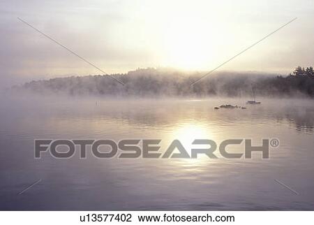 Lake Shrouded in Autumn Morning Fog, Squam Lake, New Hampshire View Large Photo Image Stock Image - Lake Shrouded in Autumn Morning Fog, Squam Lake, New Hampshire. Fotosearch