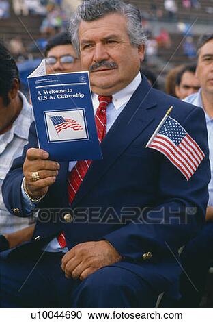 Latino American man with U. S. citizenship book at induction ceremony View Large Photo Image Stock Image - Latino American man with U. S. citizenship book at induction ceremony. Fotosearch