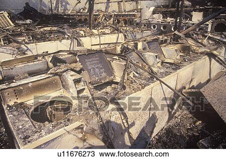Stock Image - Laundromat burned out during 1992 riots, South Central Los Angeles, California. Fotosearch