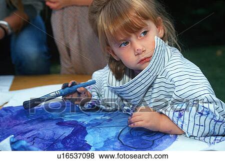 Stock Photo - Little girl painting with water colors. Fotosearch