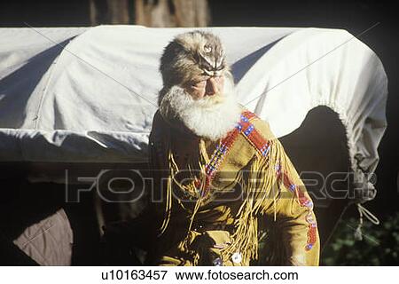 Stock Photo - Living History participants in wagon train. Fotosearch