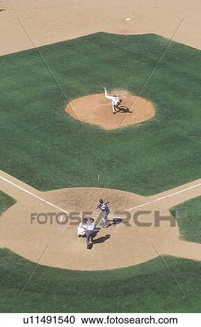 Long view of pitcher and catcher on diamond View Large Photo Image Stock Image - Long view of pitcher and catcher on diamond. Fotosearch