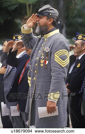 Picture - Man Dressed as Civil War Soldier Saluting. Fotosearch