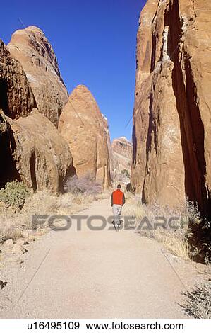 Man Hiking in Arches National Park, Utah View Large Photo Image Stock Photo - Man Hiking in Arches National Park, Utah. Fotosearch