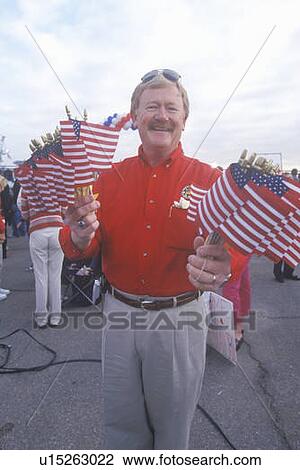 Man with miniature American flags View Large Photo Image Stock Image - Man with miniature American flags. Fotosearch