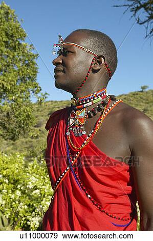 Masai Warrior in red robe View Large Photo Image Stock Photo - Masai Warrior in red robe. Fotosearch