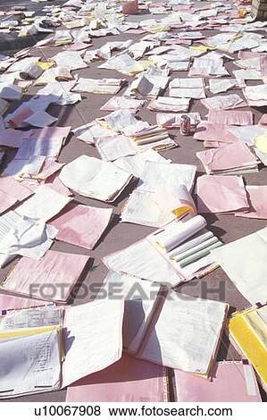 Stock Photo - Medical records strewn over the floor in a medical building after earthquake. Fotosearch