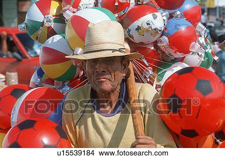 Mexican vendor selling toys View Large Photo Image Picture - Mexican vendor selling toys. Fotosearch