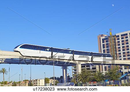 Stock Image - Monorail train with tourists in Las Vegas, NV. Fotosearch