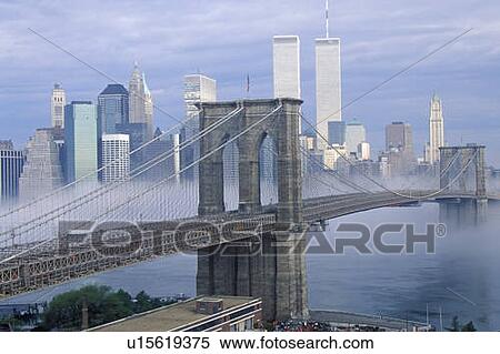 Morning fog over the Brooklyn Bridge looking into Manhattan, NY View Large Photo Image Stock Photography - Morning fog over the Brooklyn Bridge looking into Manhattan, NY. Fotosearch