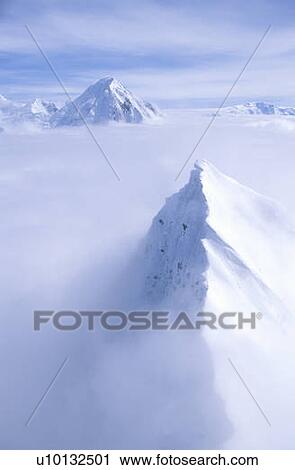 Stock Image - Mountain tops in St. Elias National Park and Preserve. Fotosearch