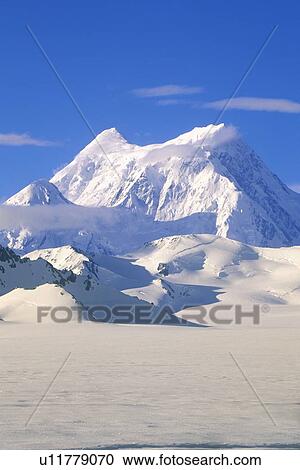 Stock Image - Mountain tops in St. Elias National Park and Preserve. Fotosearch