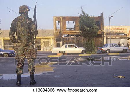 Stock Photograph - National Guardsman patrolling after 1992 riots, South Central Los Angeles, California. Fotosearch