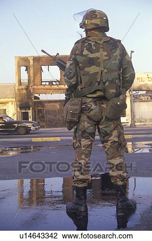 National Guardsman standing in front of burned business after 1992 riots, South Central Los Angeles, California View Large Photo Image Stock Image - National Guardsman standing in front of burned business after 1992 riots, South Central Los Angeles, California. Fotosearch