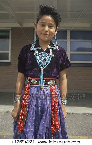 Native American Navajo girl wearing colorful dress and jewelry View Large Photo Image Stock Image - Native American Navajo girl wearing colorful dress and jewelry. Fotosearch