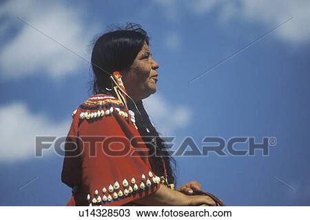 Stock Image - Native American woman on horseback. Fotosearch