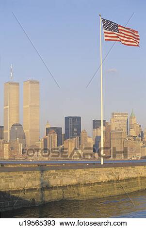 Stock Image - New York Harbor at sunset as seen from Ellis Island, NY. Fotosearch
