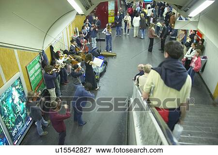 Stock Photo - Orchestra musicians playing in Metro Station. Fotosearch