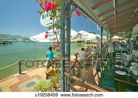 Stock Photo - Outdoor seafood restaurant. Fotosearch