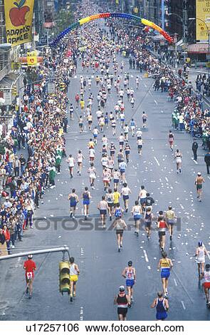 Stock Photograph - Overhead view of runners on 1st Avenue, NY City, NY Marathon. Fotosearch