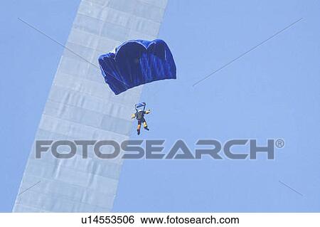 Stock Photograph - Parachutist over arch, St. Louis, Missouri. Fotosearch