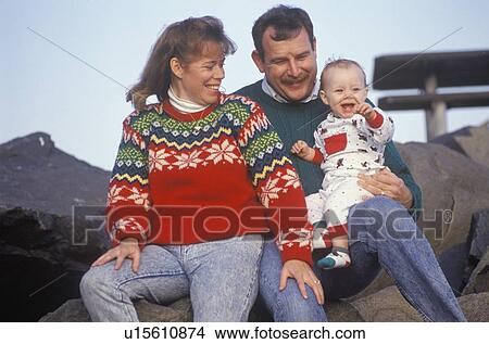 Parents and their baby at the beach View Large Photo Image Picture - Parents and their baby at the beach. Fotosearch