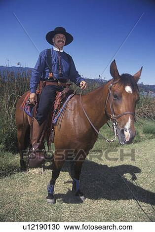 Participant on horseback during Cowboy Reenactment View Large Photo Image Stock Image - Participant on horseback during Cowboy Reenactment. Fotosearch