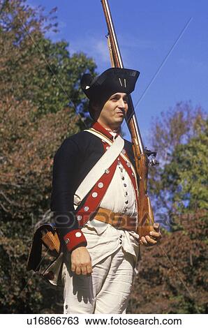 Stock Image - Participant posing as a British Army Officer during American Revolution reenactment. Fotosearch