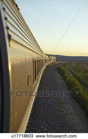 Passenger train traveling into the Arizona sunset View Large Photo Image Stock Image - Passenger train traveling into the Arizona sunset. Fotosearch