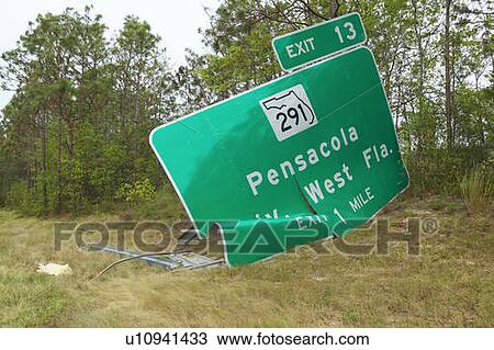 Stock Image - Pensacola road sign blown down from Hurricane Ivan in Pensacola Florida. Fotosearch