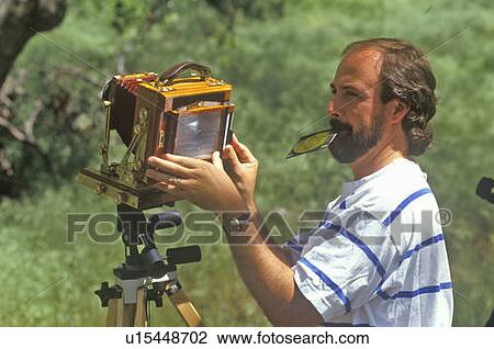 Photographer with large format 4X5 camera View Large Photo Image Stock Image - Photographer with large format 4X5 camera. Fotosearch