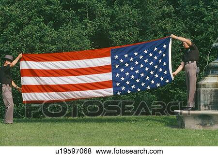 Police Officers fold an American Flag View Large Photo Image Stock Photo - Police Officers fold an American Flag. Fotosearch