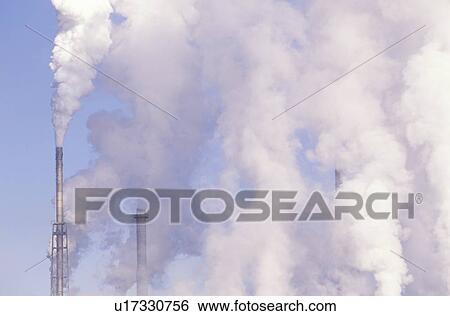 Pollution from smokestacks filling the air View Large Photo Image Stock Photograph - Pollution from smokestacks filling the air. Fotosearch