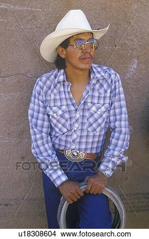 Portrait of Latino cowboy with lasso View Large Photo Image Picture - Portrait of Latino cowboy with lasso. Fotosearch