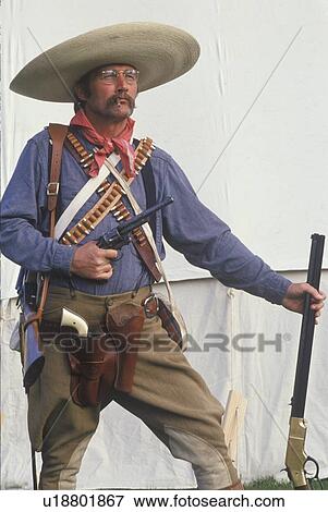 Portrait of Old West gunslinger participant with pistols View Large Photo Image Stock Photo - Portrait of Old West gunslinger participant with pistols. Fotosearch
