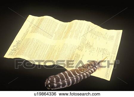 Stock Photograph - Quill pen with replica of Declaration of Independence. Fotosearch