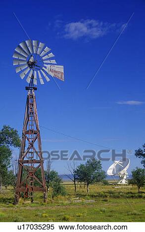 Stock Photography - Radio telescope and old windmill. Fotosearch