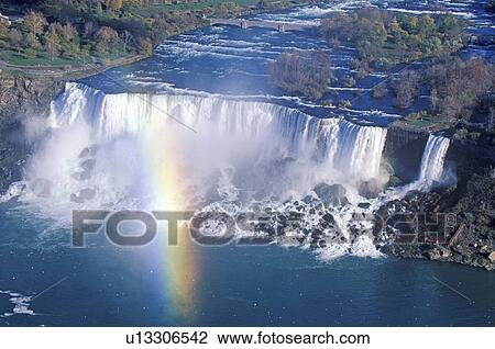 Stock Image - Rainbow Over Niagara Falls, New York. Fotosearch