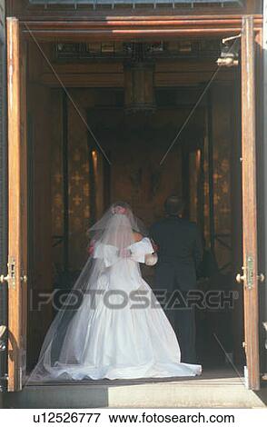 Rear view of bride entering church View Large Photo Image Stock Photo - Rear view of bride entering church. Fotosearch