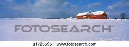 Stock Image - Red barn in the snow. Fotosearch