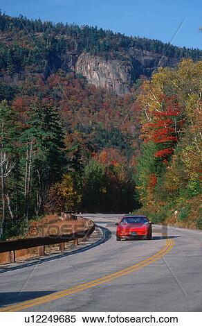 Stock Photography - Red car on the Road. Fotosearch
