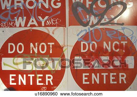 Red signs reading? Wrong Way, Do Not Enter? covered with graffiti View Large Photo Image Stock Image - Red signs reading? Wrong Way, Do Not Enter? covered with graffiti. Fotosearch