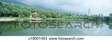 Stock Image - Reflection of Pagoda Pavilion in Dali. Fotosearch