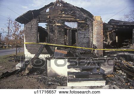 Remains of a burned down house View Large Photo Image Stock Photo - Remains of a burned down house. Fotosearch