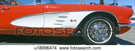 Picture - Restored red 1959 Corvette, fender close-up, Portland, Oregon. Fotosearch
