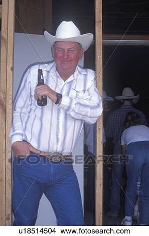Retired cowboy having a beer View Large Photo Image Picture - Retired cowboy having a beer. Fotosearch